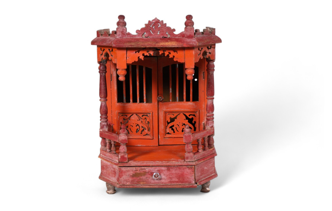 Antique wooden prayer temple with decorations and chiselling