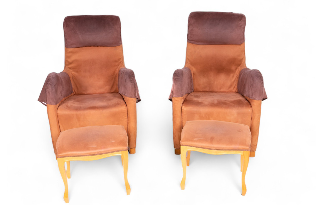 Two brown suede armchairs with footrest